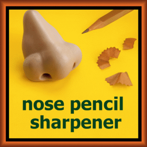 Novelty nose pencil sharpener in a skin tone color, with a pencil inserted into the nostril.